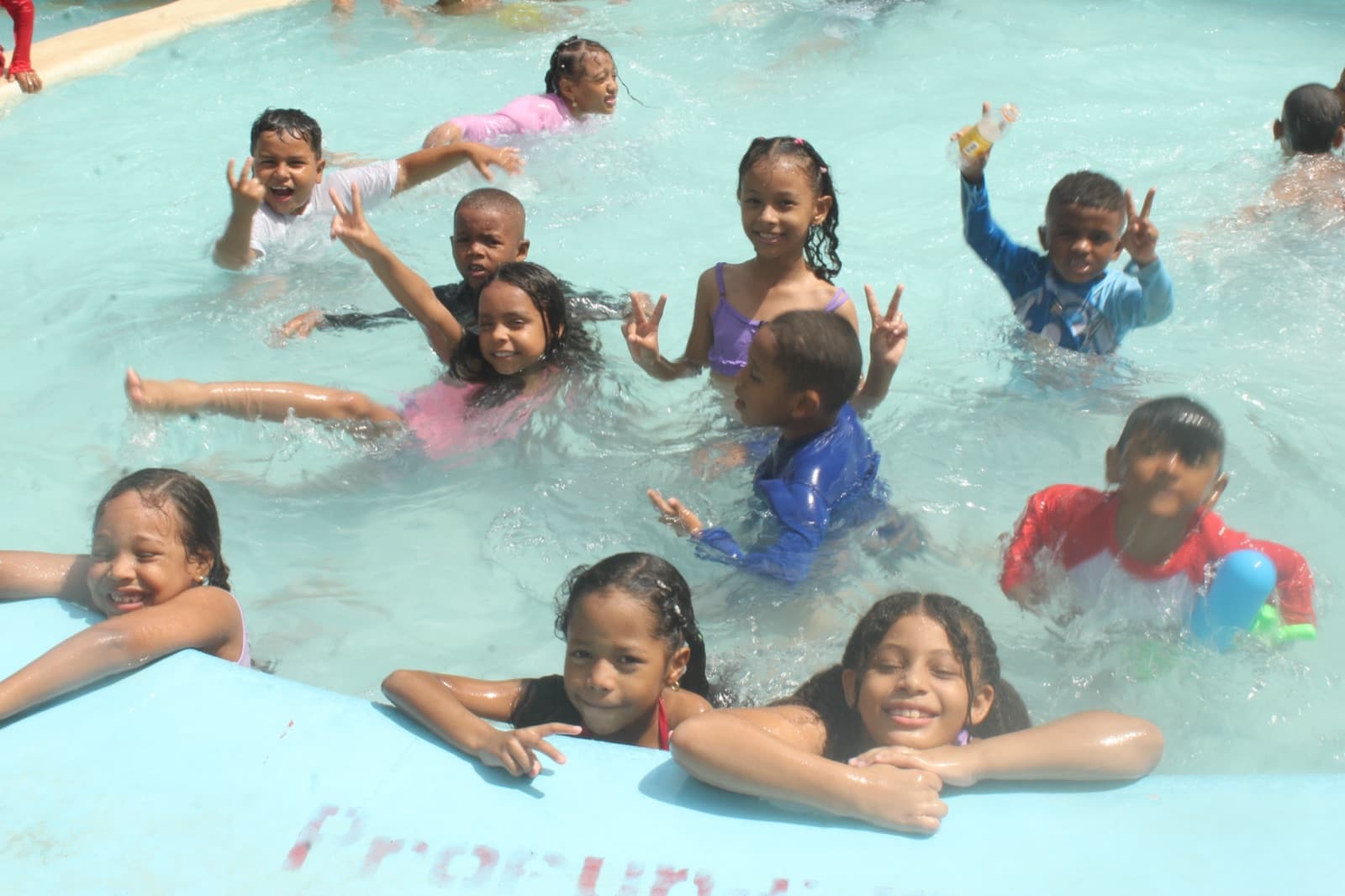 Children playing in the pool on the outing day