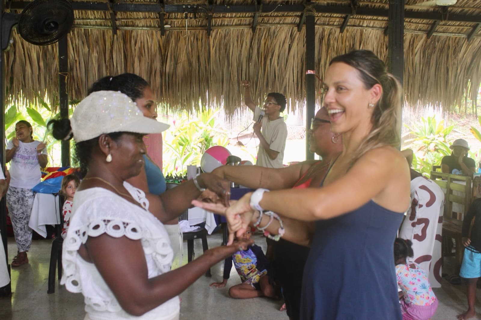 A volunteer dancing with a neighbor at the gathering