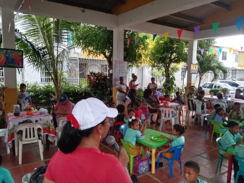 Children eating together at the community kitchen